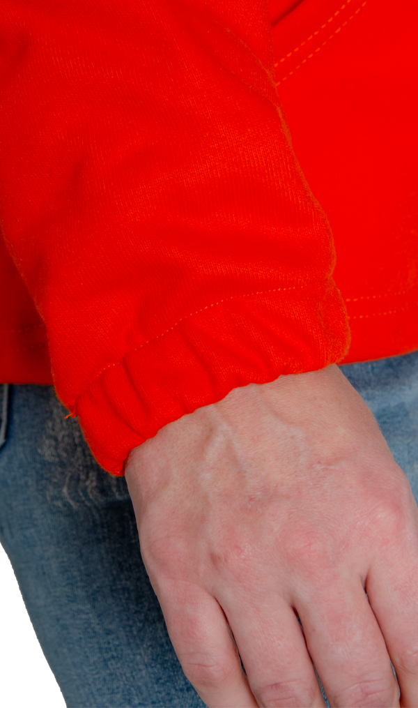 Image of MWG BLOCKER FRC fleece hoodie sleeve cuff. Bright orange in colour. Fleece is an inherent flame-resistant (FR) fabric.