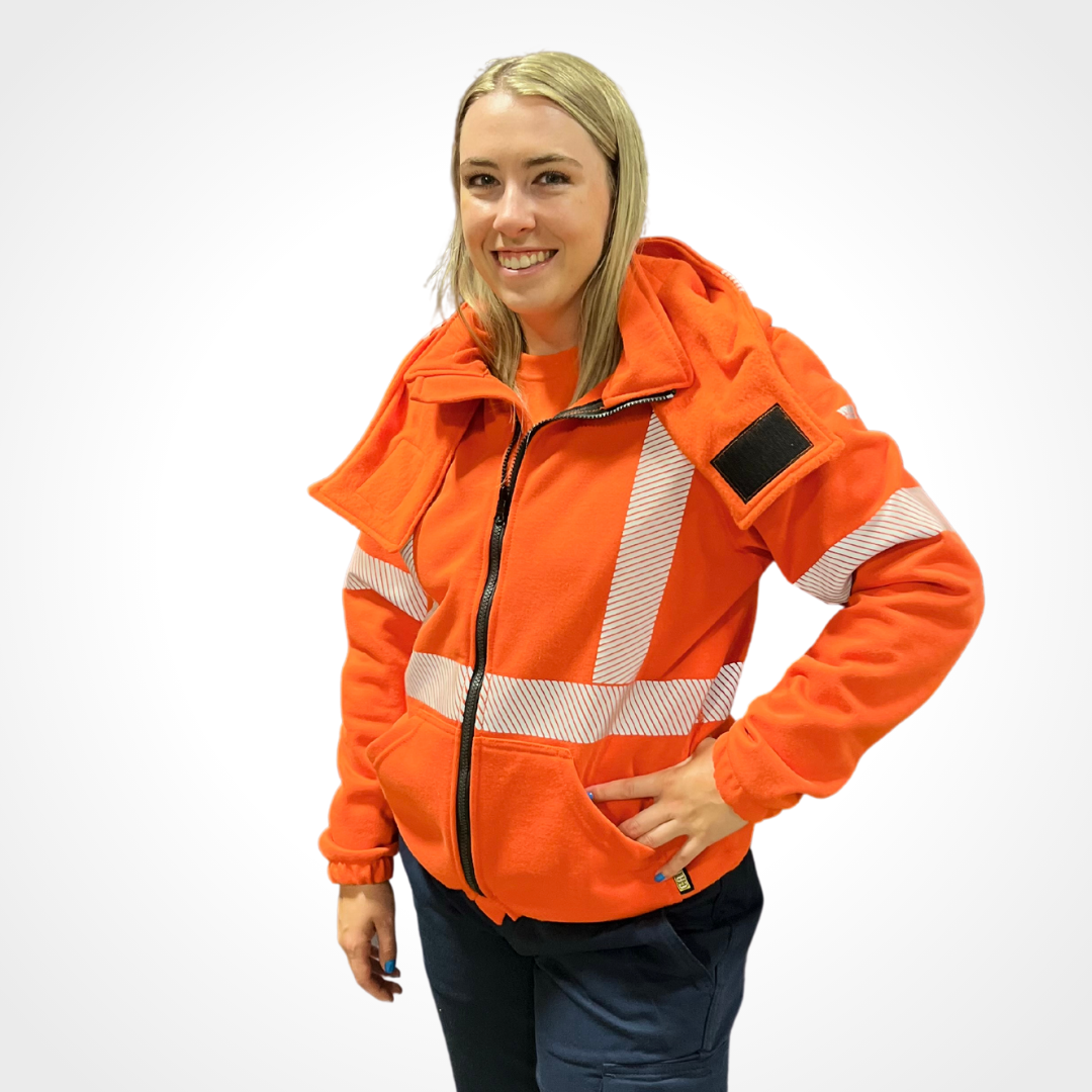MWG BLOCKER Women's FR Hoodie. Women's FR Hoodie is bright orange with silver FR reflective striping on torso and sleeves for high-visibility. MWG BLOCKER is a heavyweight inherent flame-resistant (FR) fleece. FR Hoodie has two front pockets, black FR zipper and a large detachable hood. All components of FR Hoodie are flame-resistant.