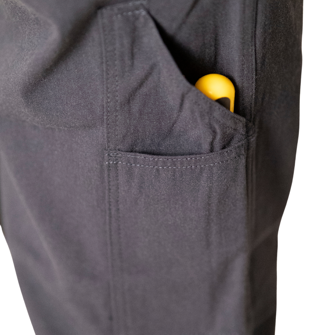 Close up image of tool pocket on MWG COMFORT WEAVE Women's FR Utility Pant. Tool pocket is built to fit screwdriver and hammer comfortably.