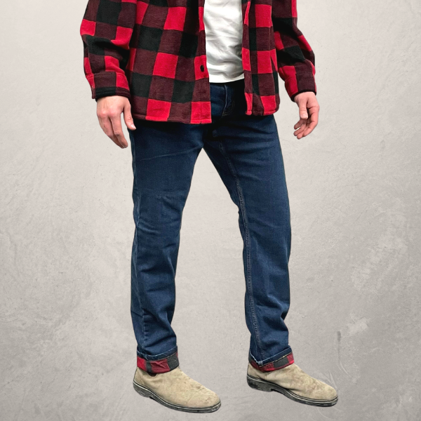 Image of MWG Flannel-Lined Stretch Denim Jeans. Flannel-Lined Stretch Denim Jeans are navy with a red and black flannel-lining. Image shows MWG Jeans rolled at bottom to display the flannel lining.