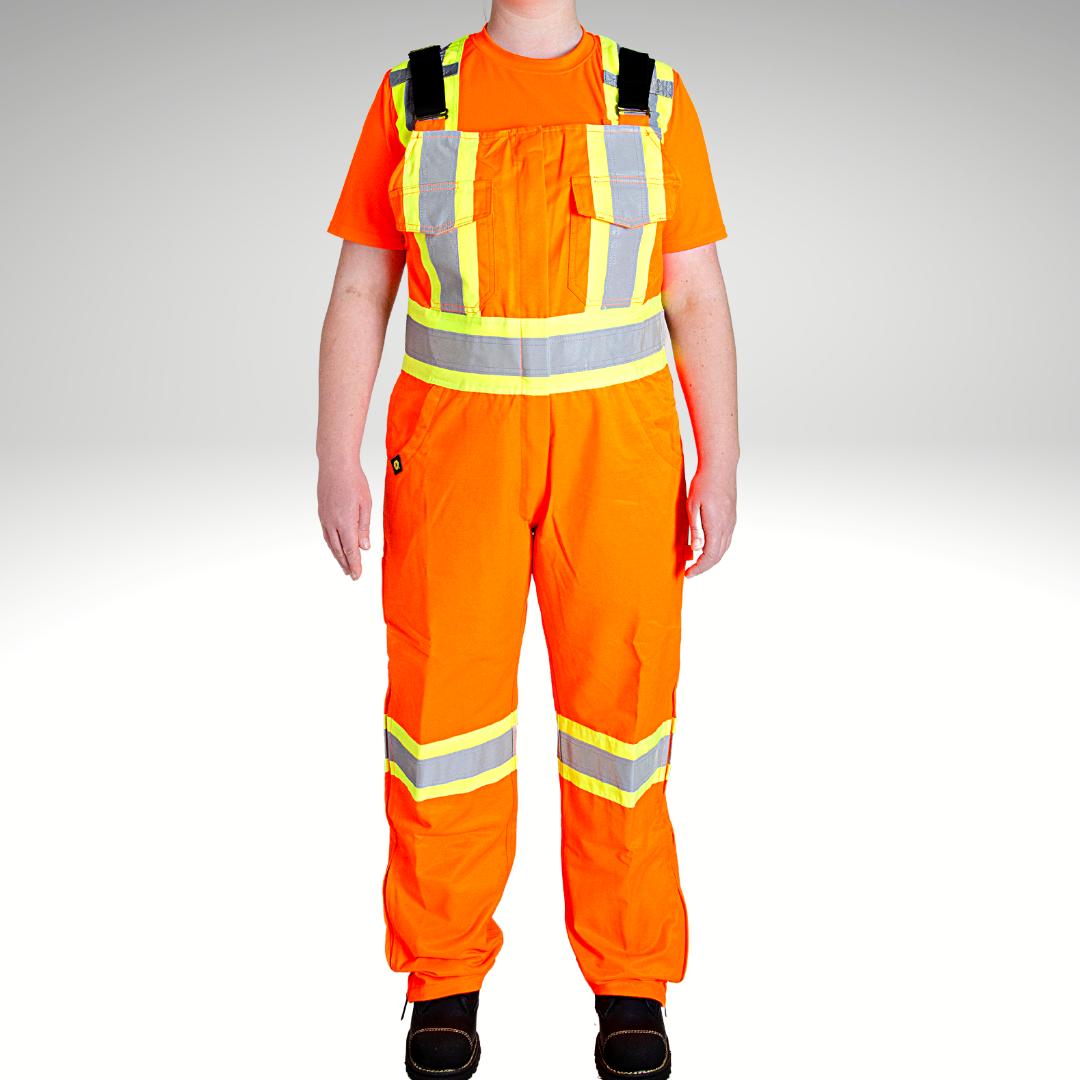 Image of MWG Women's Hi-Vis Unlined Bib Overalls. Women's Hi-Vis Overalls are bright orange in colour with black straps. Yellow/silver/yellow high-visibility reflective tape on torso and legs. Two large chest pockets. 