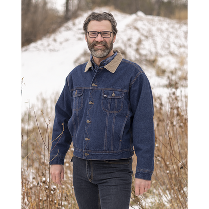 Image of MWG Storm Rider Lined Jean Jacket. MWG Denim Jacket is navy in colour. Jean jacket has a tan corduroy collar. Buttons are gold as well as the stitching. Model is wearing MWG Storm Rider Jacket with MWG stretch denim blue jeans.