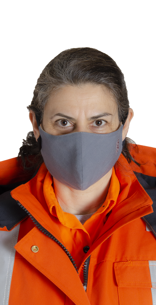 Image of woman wearing MWG Gray Cup FRC face mask. FR Face mask is grey in colour and made from MWG COMFORT WEAVE, an inherent flame-resistant FR fabric.