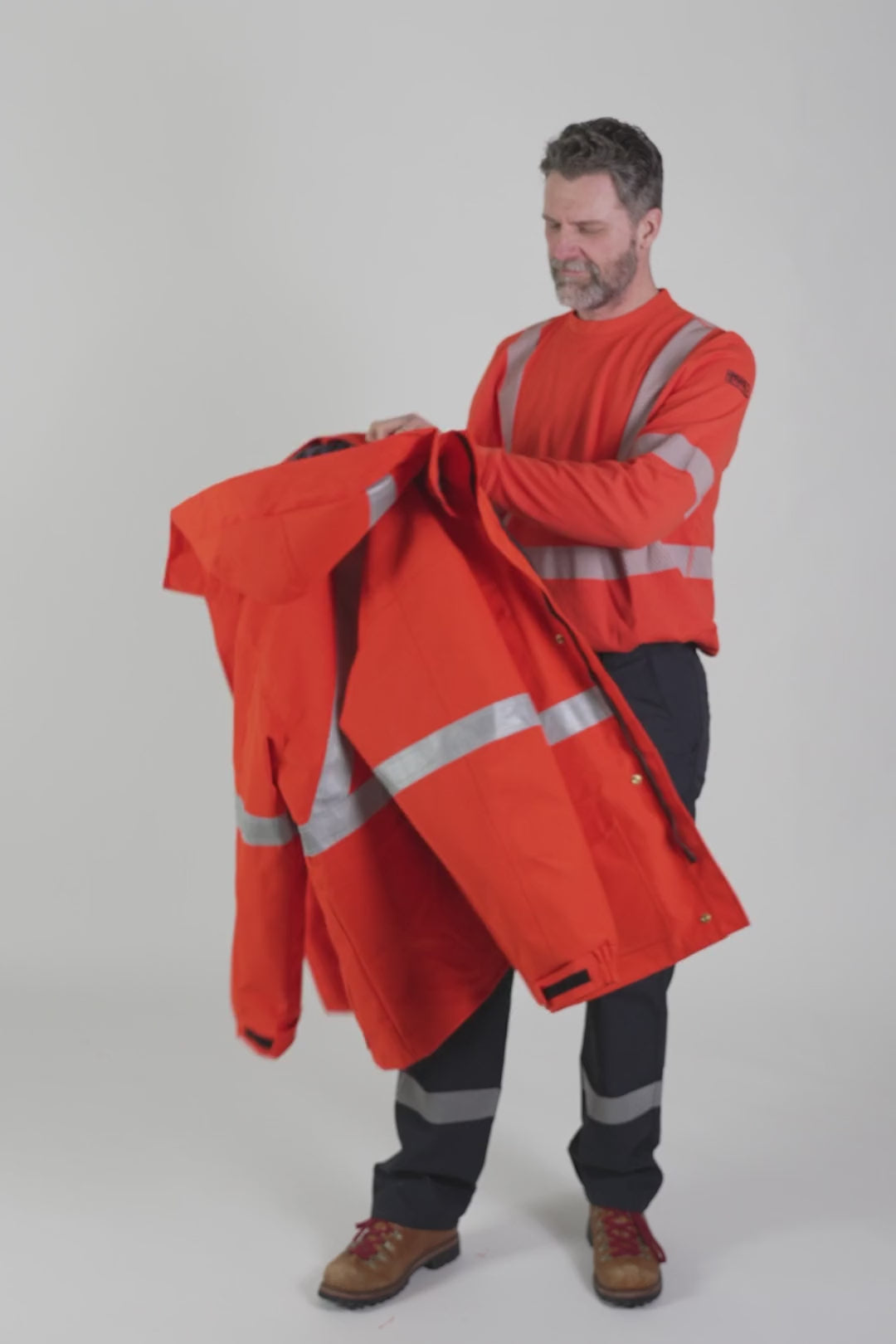 MWG STORMSHIELD Men's FR Parka Shell. FR Parka is bright orange with silver reflective. FR Jacket is CAT 2 FR.