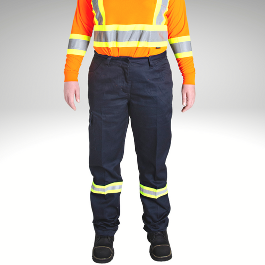 Image of MWG Women's Hi-Vis cargo pant. Women's Hi-Vis Cargo Pant is navy in colour with yellow/silver/yellow reflective striping on lower leg below the knees. Model is wearing women's hi-viz pant with bright orange hi-vis t-shirt.