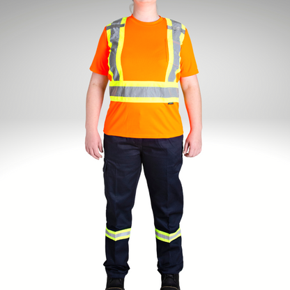 Image of MWG Women's Hi-Vis Short Sleeve T-Shirt. Women's Hi-Vis T-Shirt is bright orange with yellow/silver/yellow reflective tape on torso. Left chest has a pocket and both shoulder have a radio clip. Model is wearing MWG Hi-Vis shirt with women's hi-vis cargo pants.